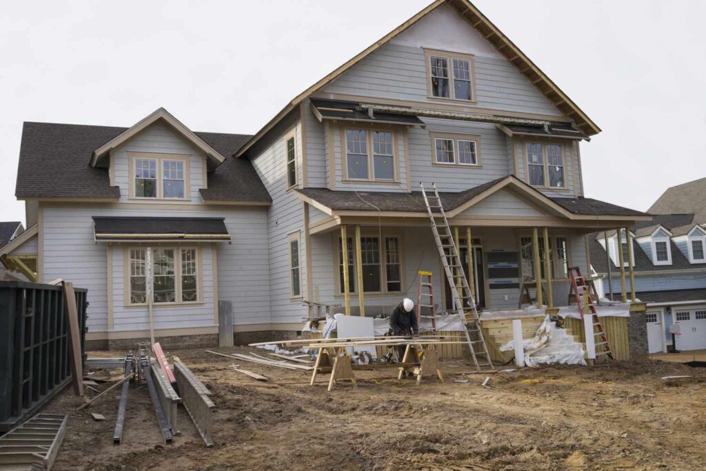 Roofing siding worker house exterior